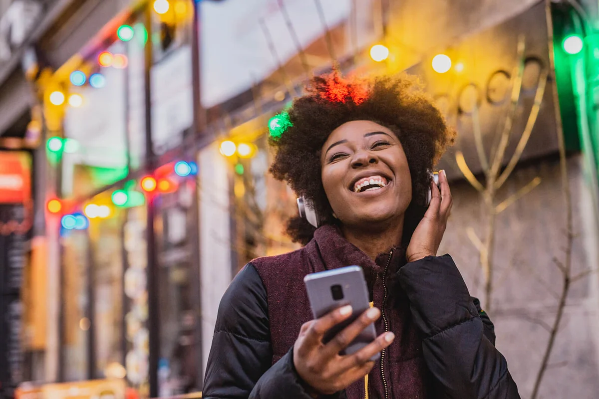 African American woman listening music