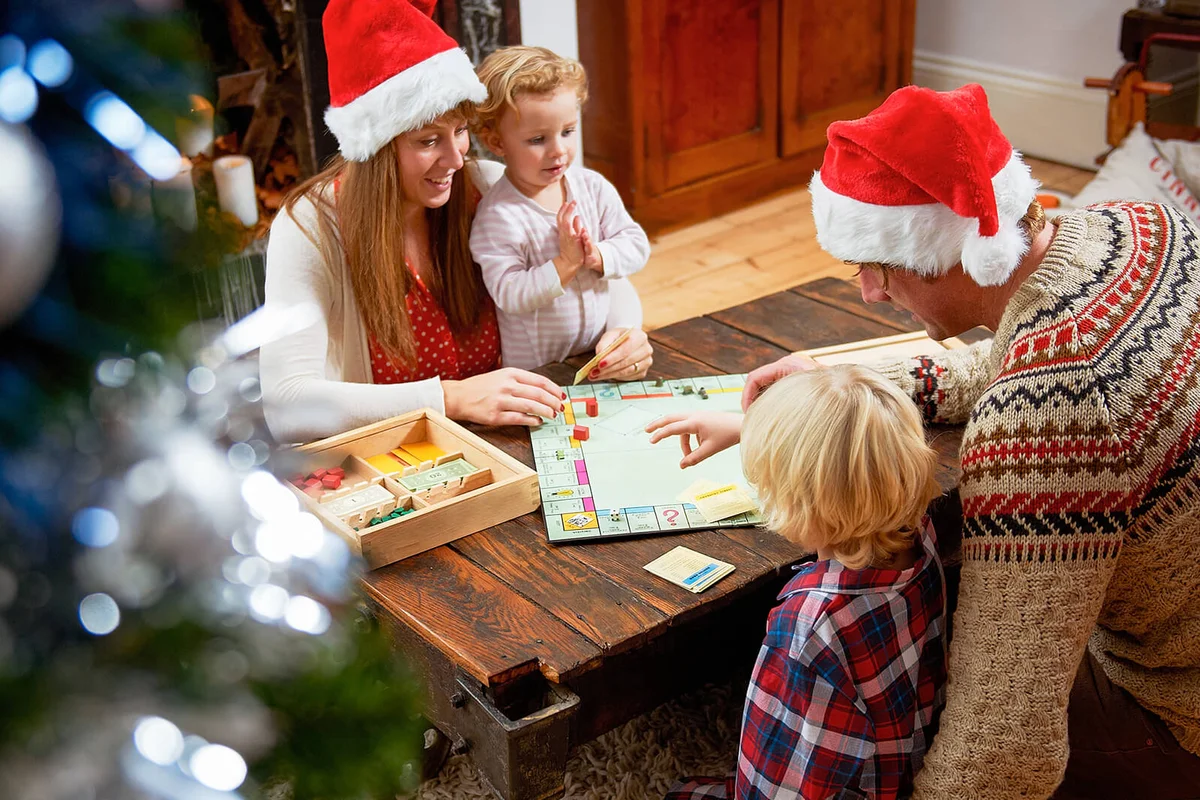 Family with board game at Christmas