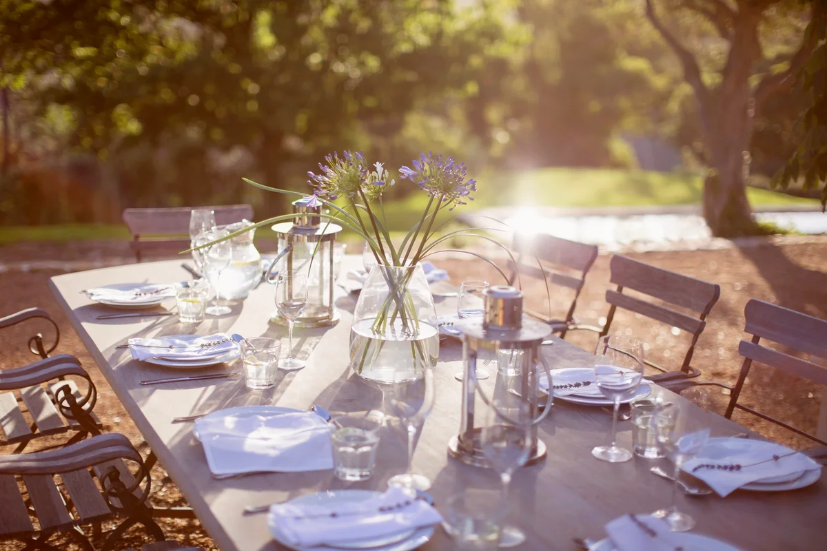Bouquet and place settings on patio table