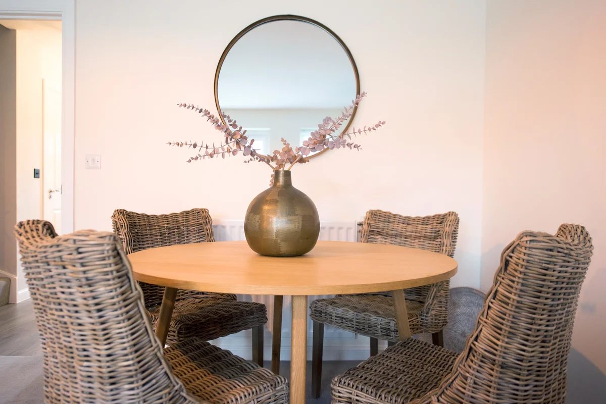 Dining room table with neutral floral centerpiece