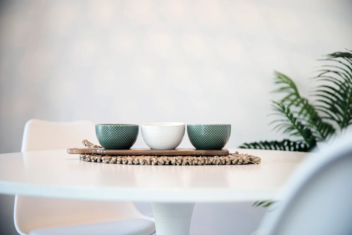 Empty, colored bowls on the dining table