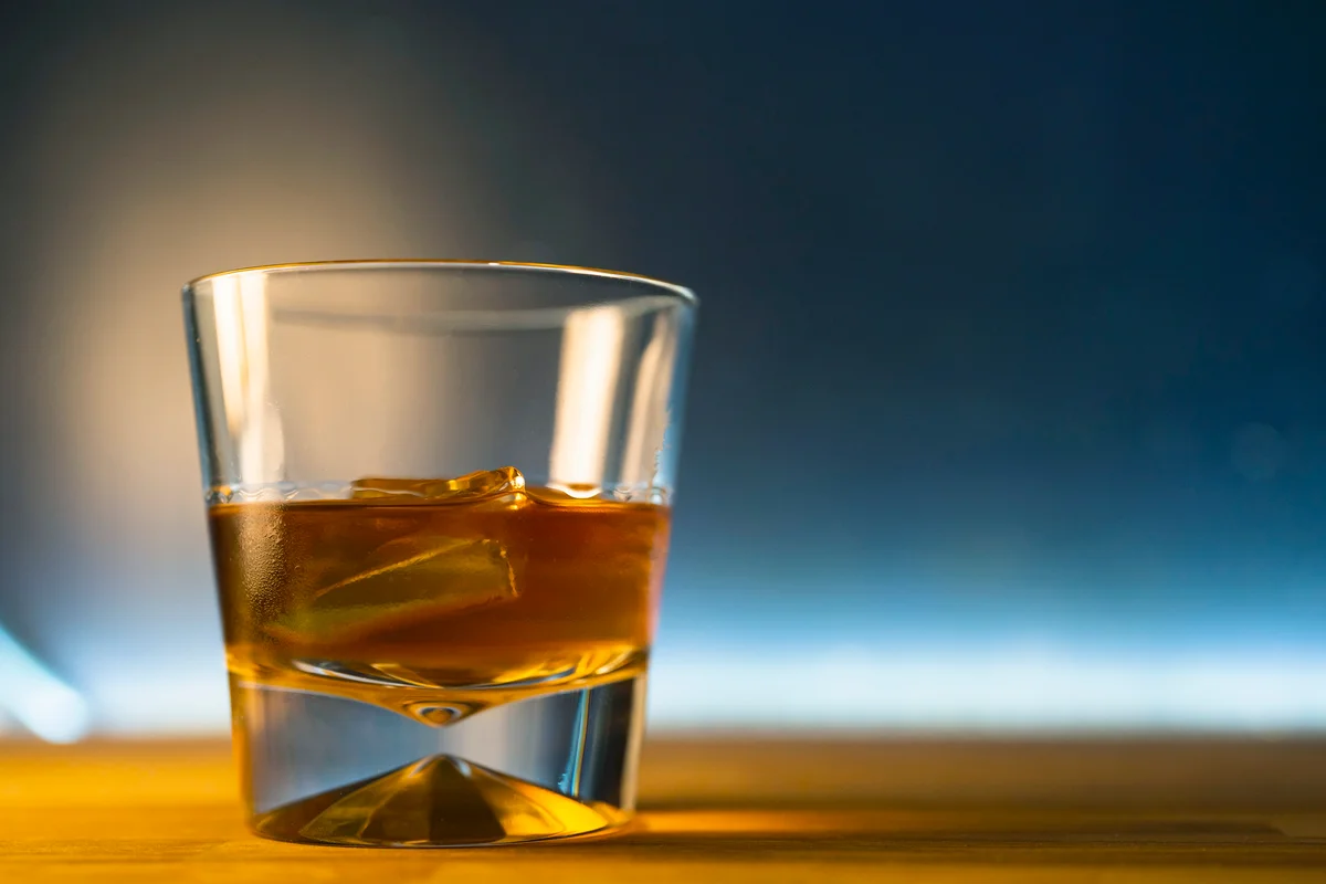 Glass of rum with ice