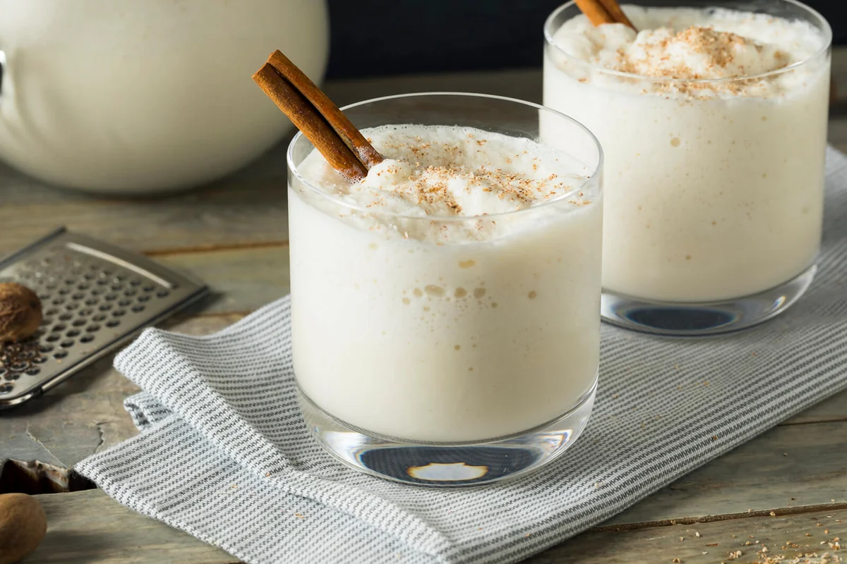 Two glasses of spiced rum milk punch