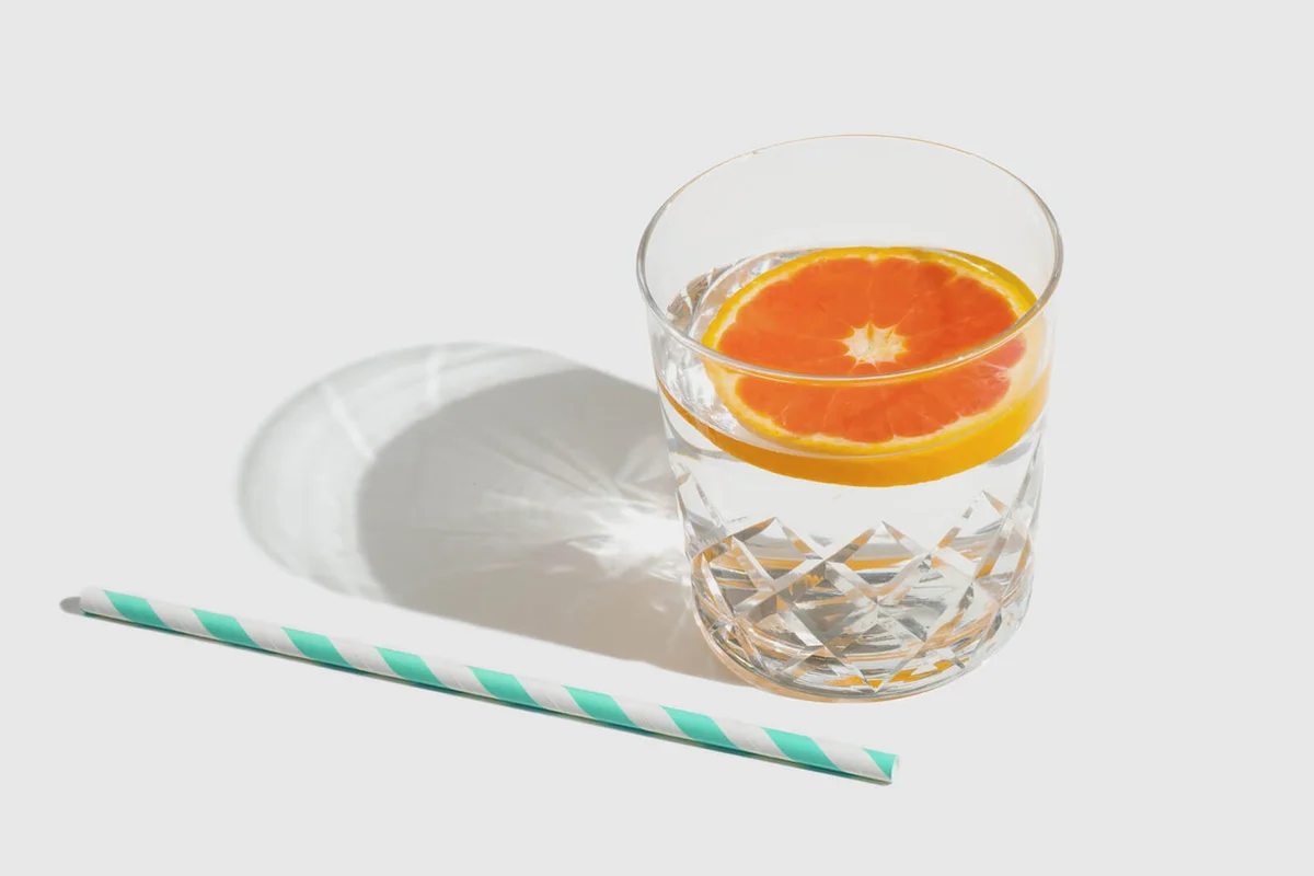 Glass of clarified milk punch with vodka and rum