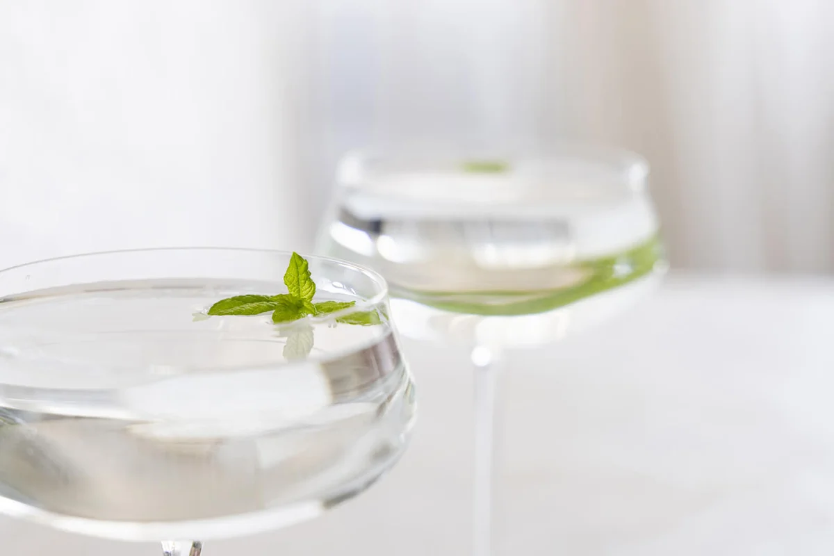 Clarified milk punch with mint sprigs