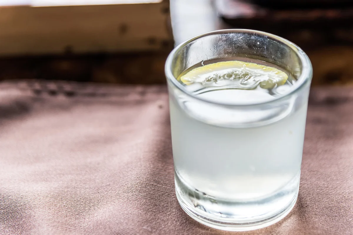 Glass of clarified milk punch with gin