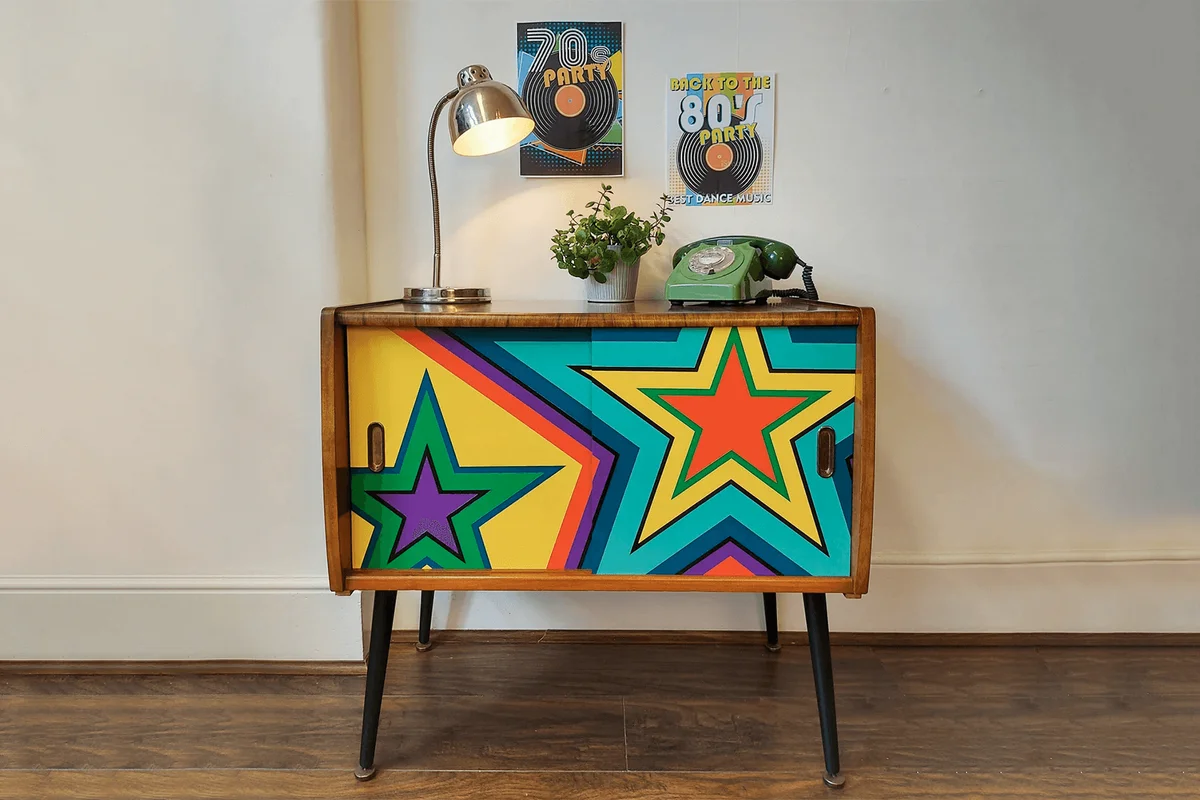 Old radio cabinet updated with trippy paint job