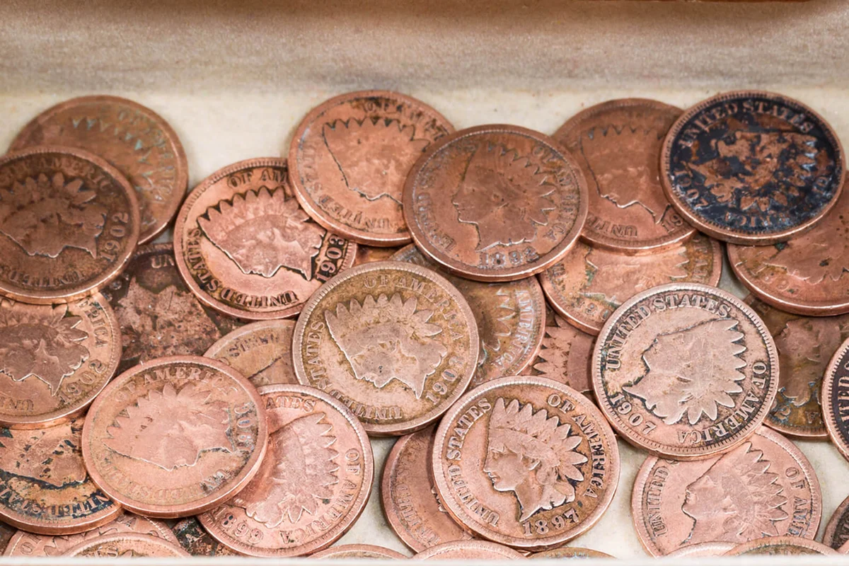 Oak antique dresser drawer filled with old Indian Head Cents