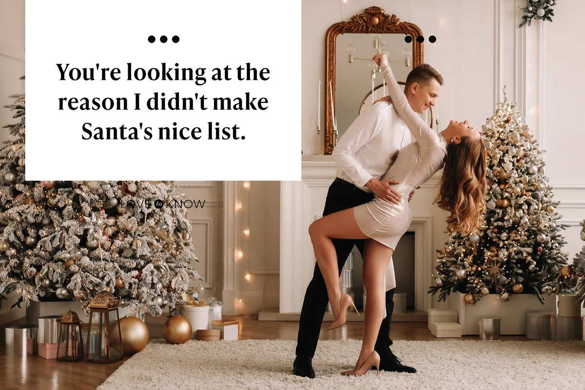 Couple dancing among Christmas trees