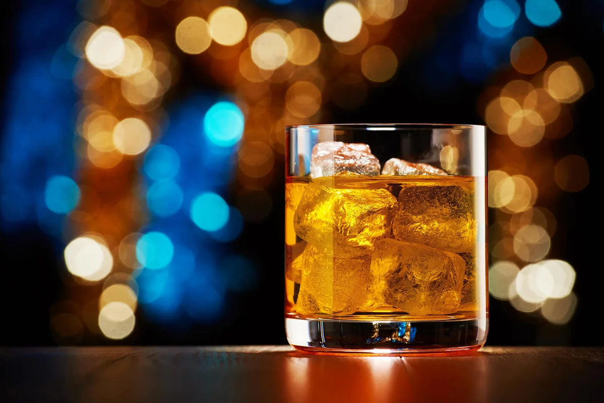 Glass of whiskey with ice