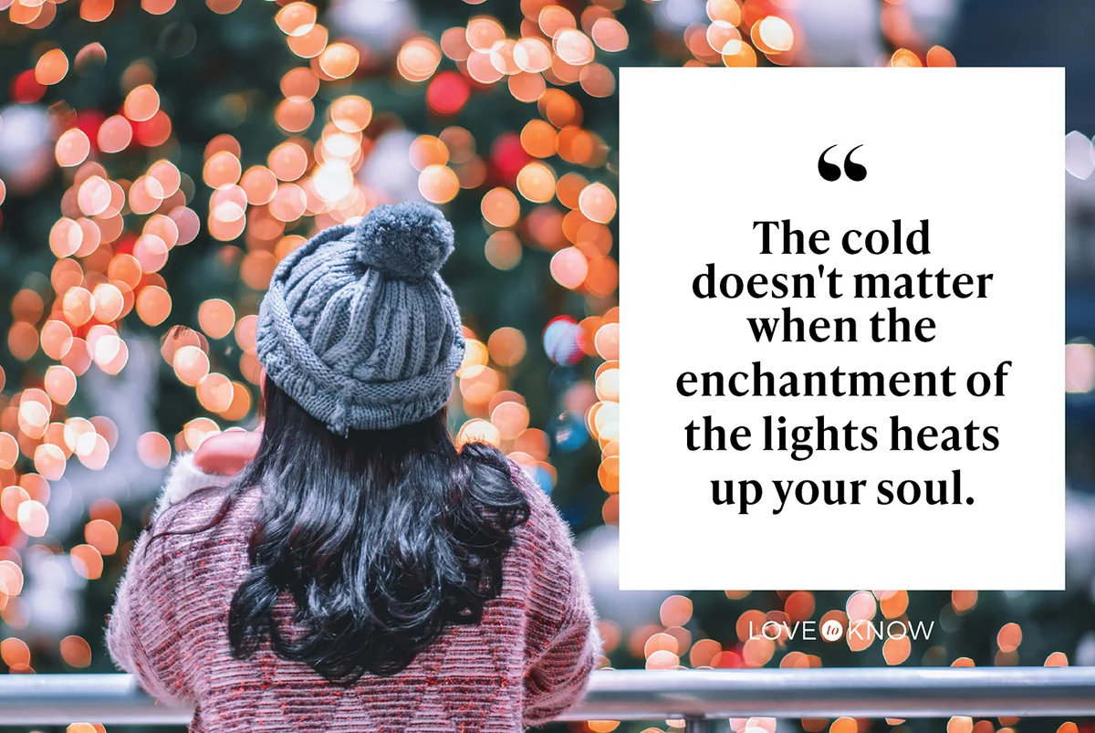 Woman Looking At Illuminated Christmas Lights