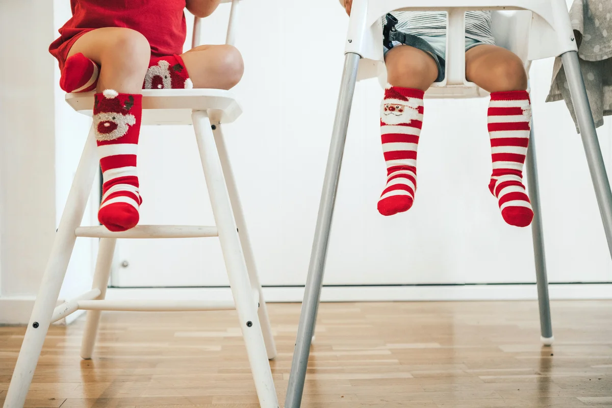 Baby brothers wearing christmas socks