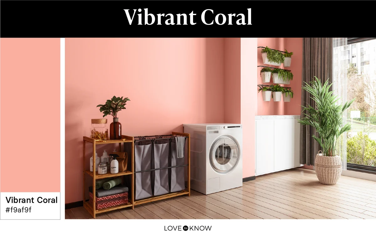 Laundry room designed in vibrant coral color palette