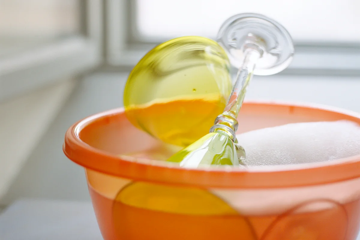 Wine glasses soaking in white vinegar