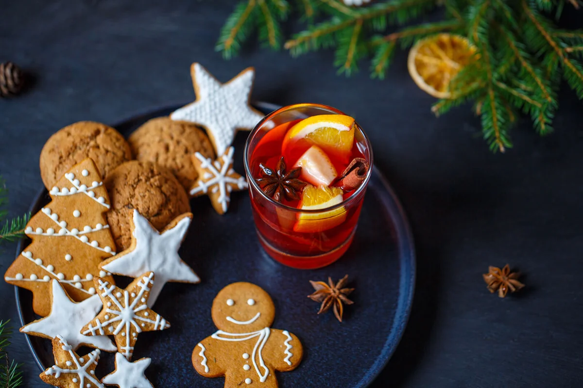 A glass of hot mulled wine, ginger cookies