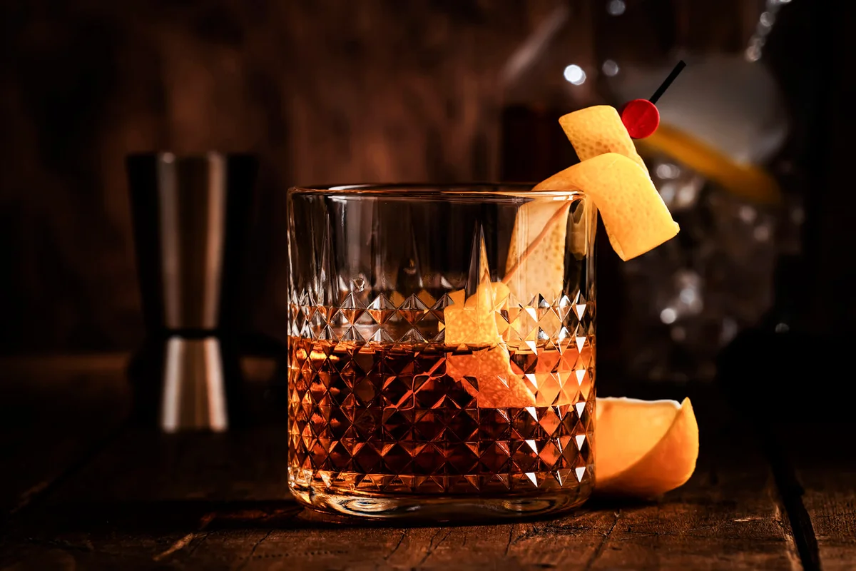 Sazerac, classic alcoholic cocktail with cognac, bourbon, absinthe, bitters, sugar and lemon zest