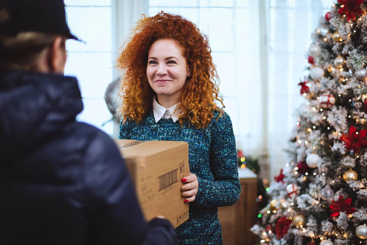 Woman getting parcel during Christmas holidays