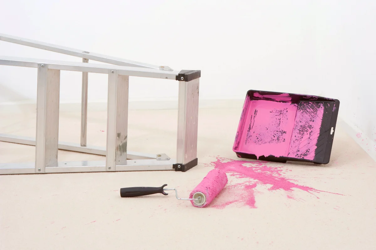 Spilt pink paint on carpet