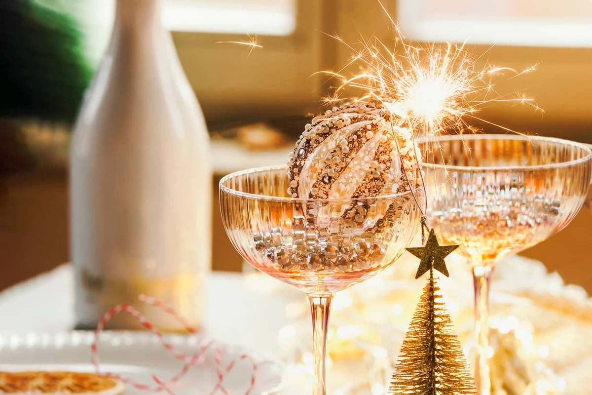 Christmas table setting with champagne glasses