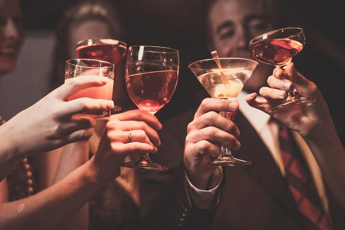 A man and four women are celebrating their success