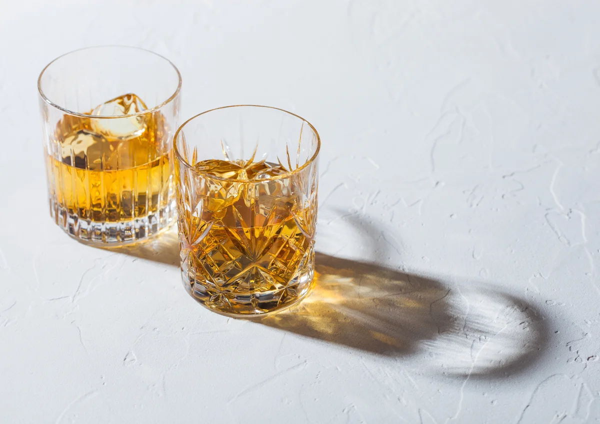 Glasses with ice cubes of single malt whiskey