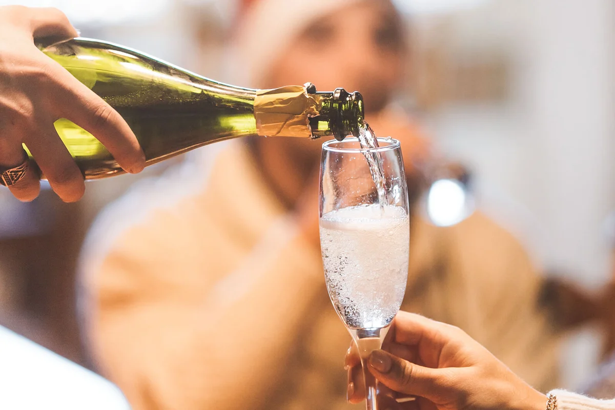 Family celebration with prosecco