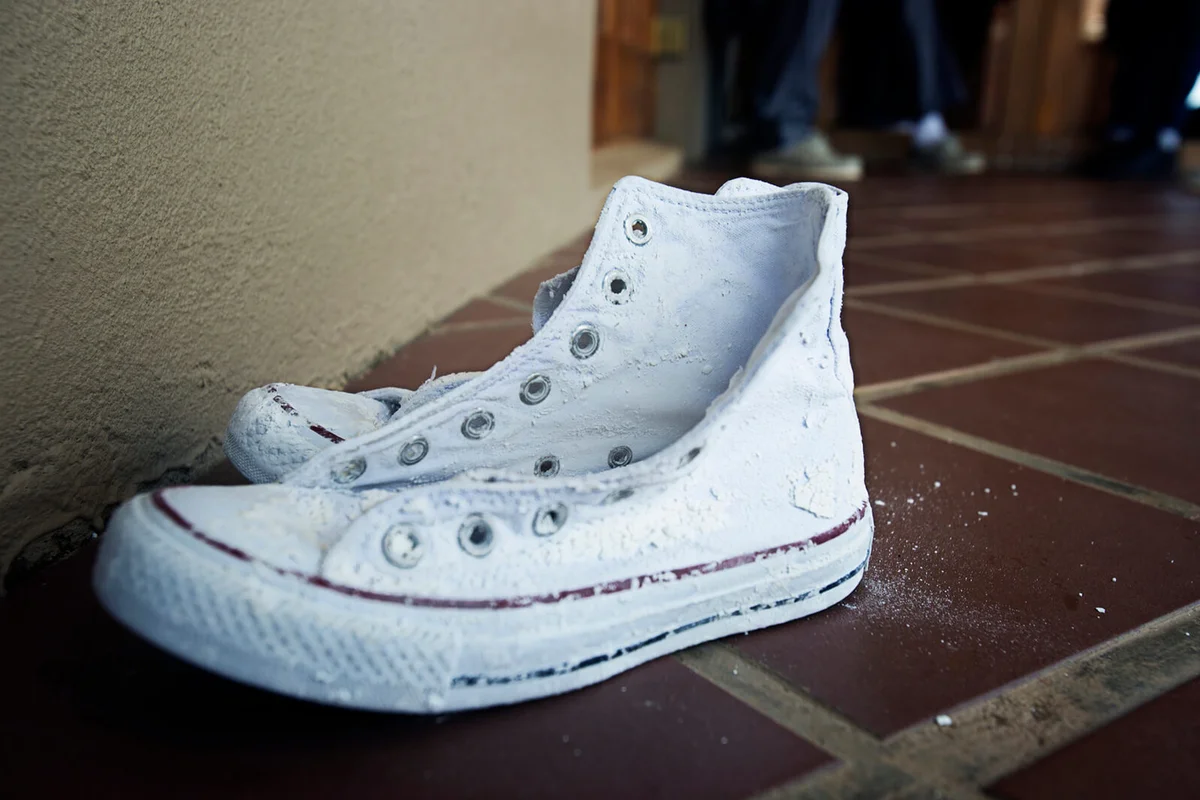 White washed sneakers on the floor
