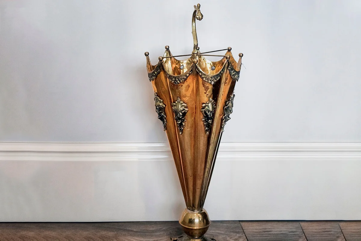 Brass umbrella stand in an office