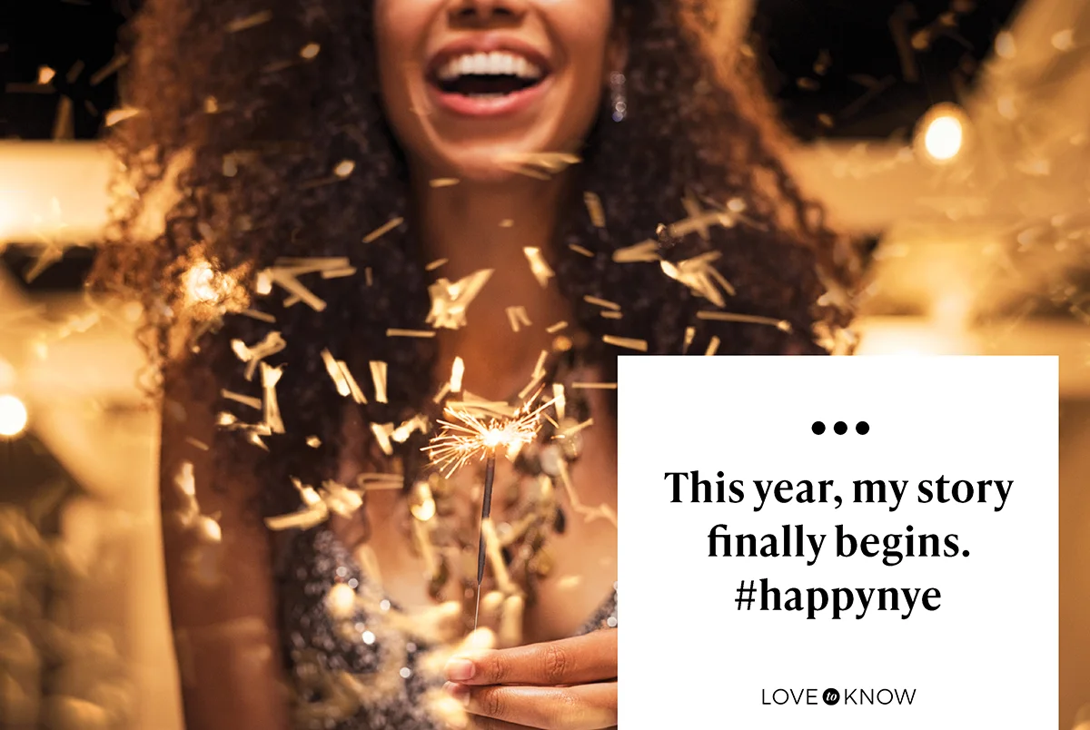 Happy woman holding fire sparkler