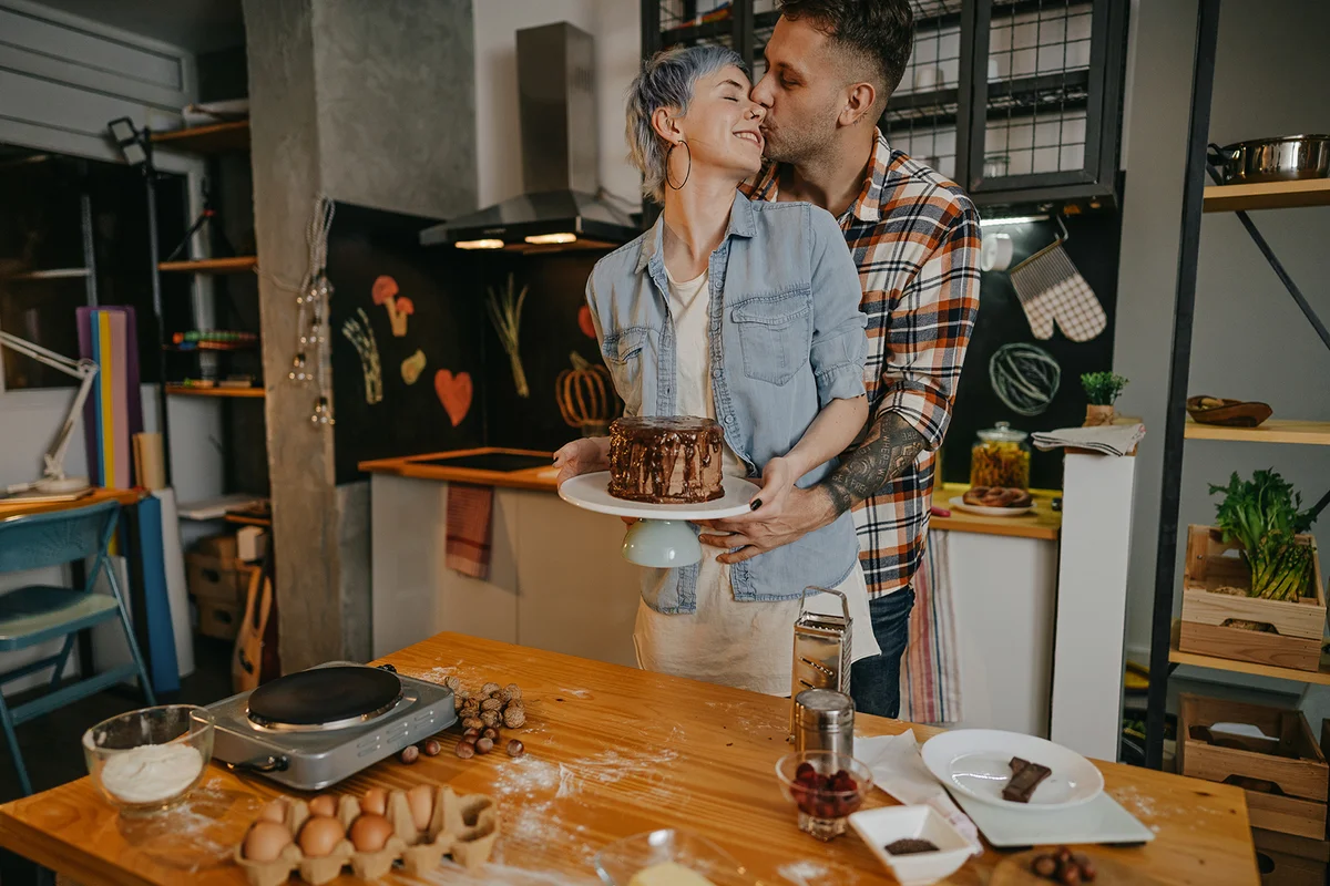 Loving couple with homemade cake