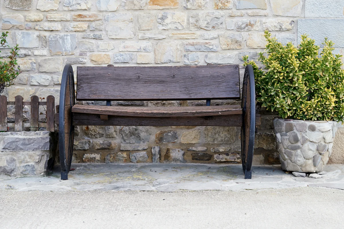 Rustic wooden bench near front door