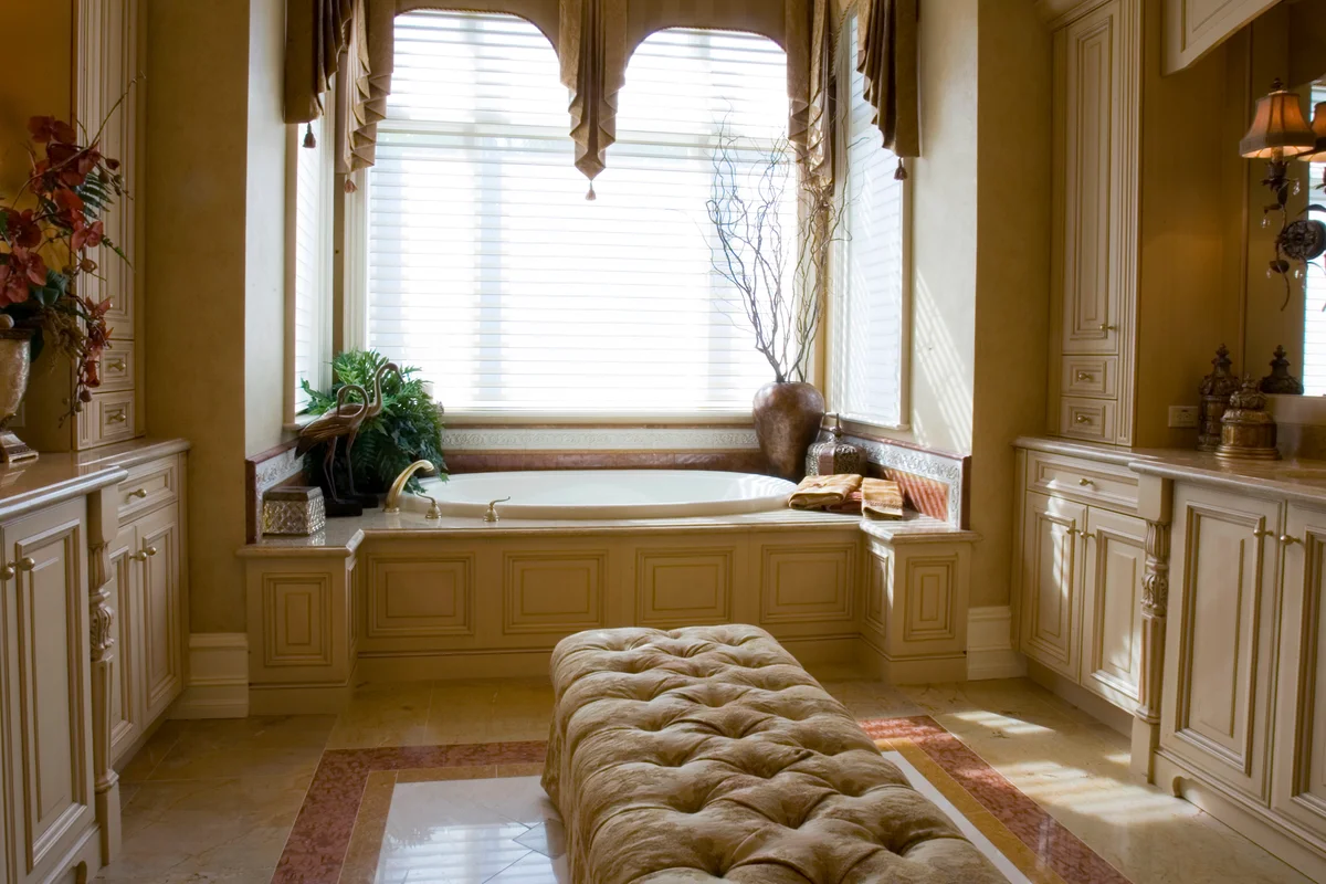 Upholstered bench in master bedroom