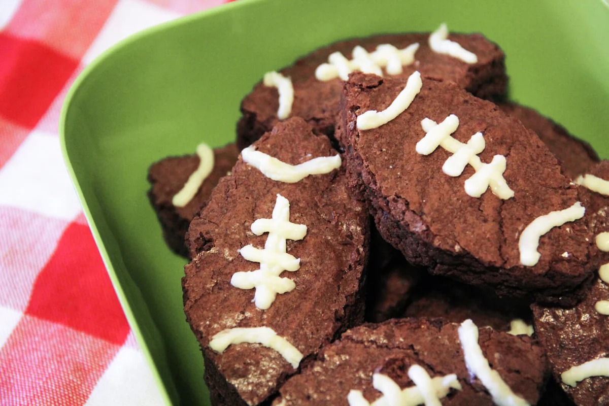 Brownies shaped and decorated to look like footballs