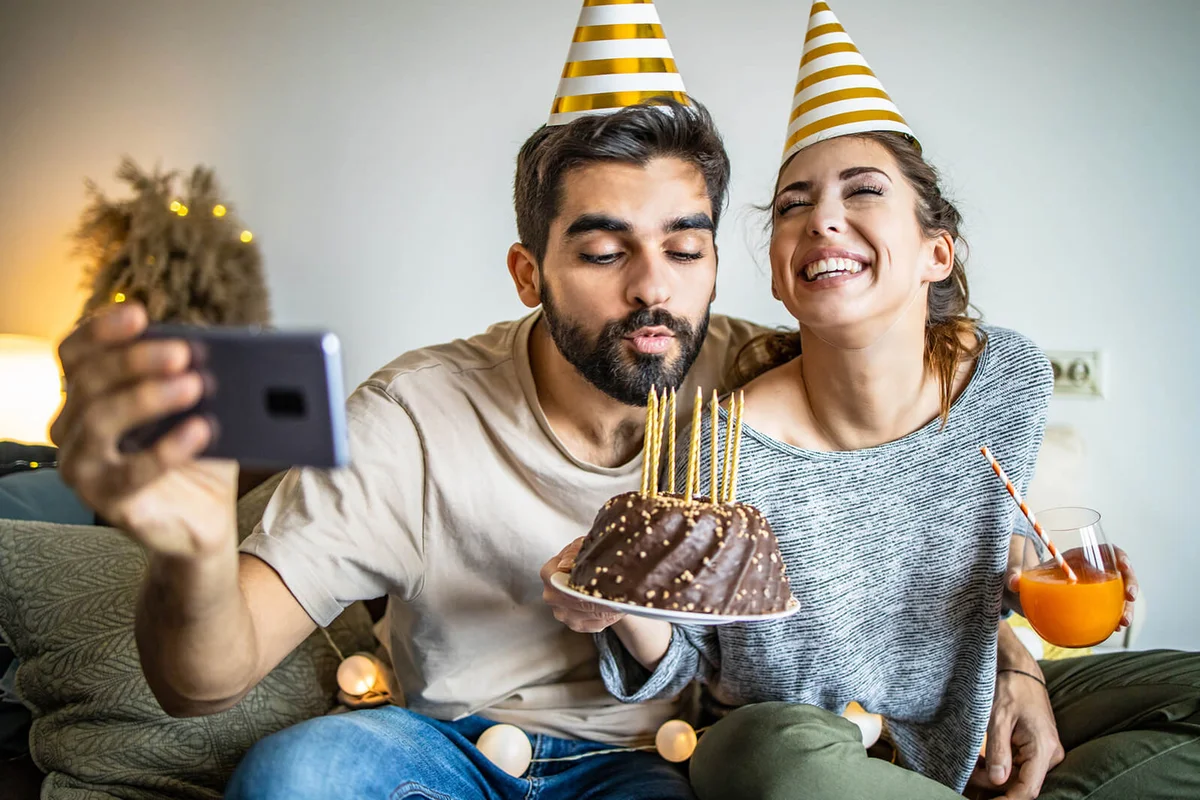 Young couple having a celebration at home