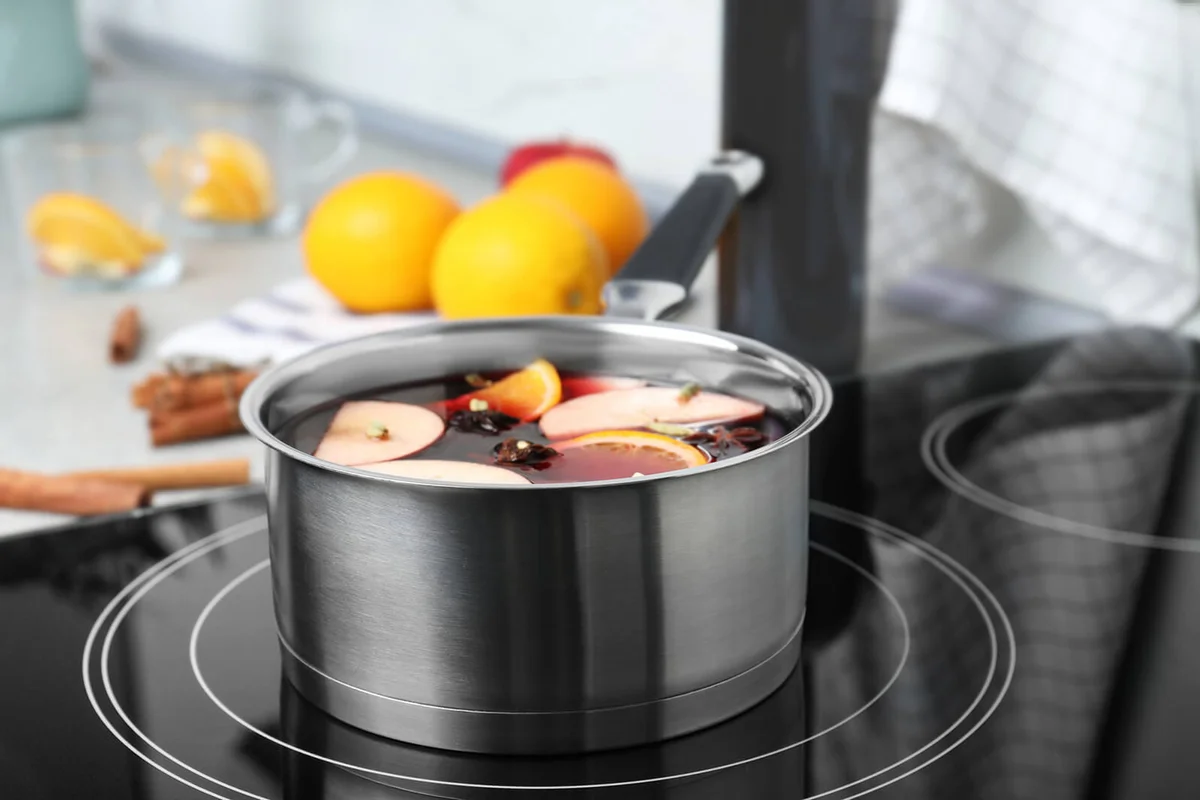 Delicious hot mulled wine in pot on stove