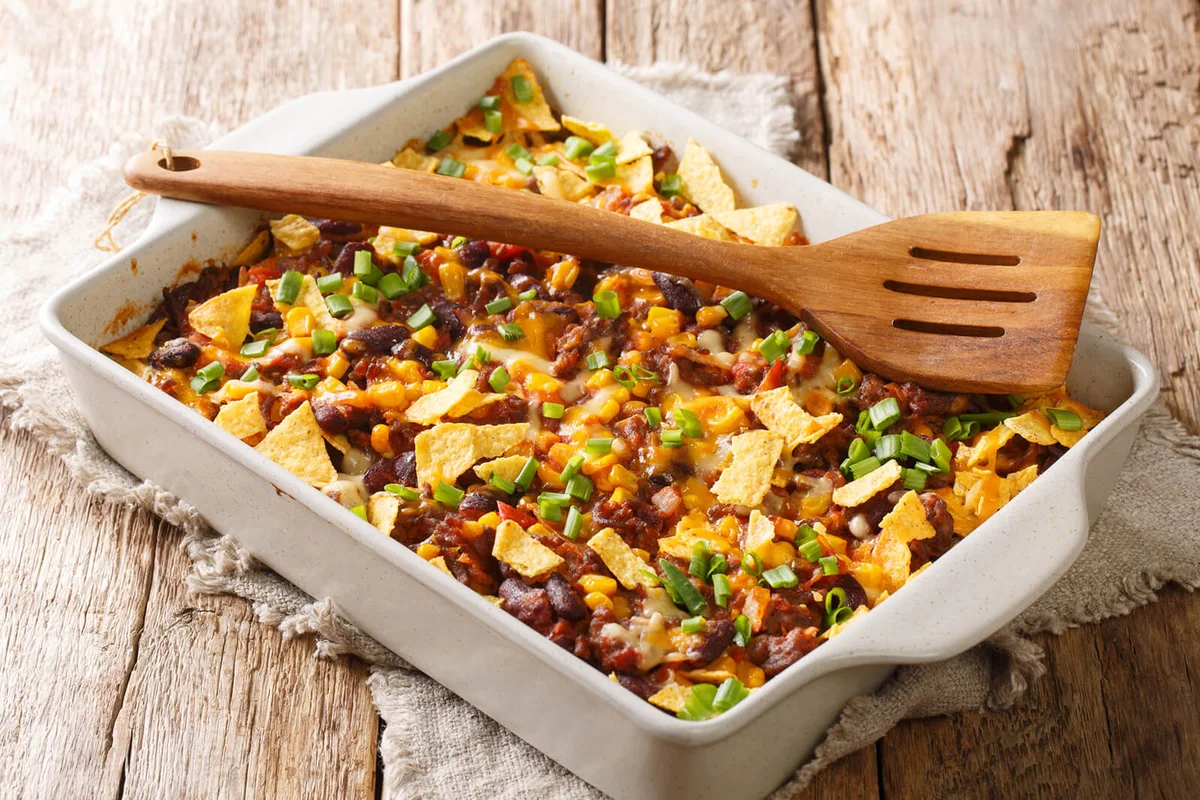 Crispy homemade frito pie with beef, cheese, corn, beans and chips