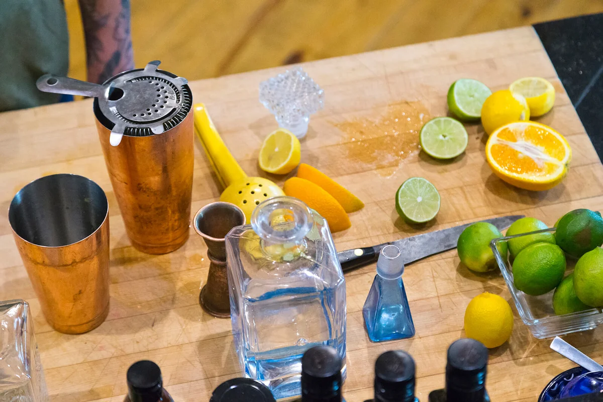 Mixing cocktails in their kitchen of a home