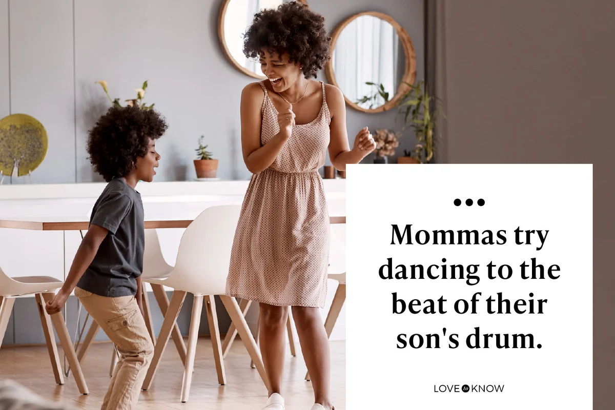 happy young mother and son dancing together at home