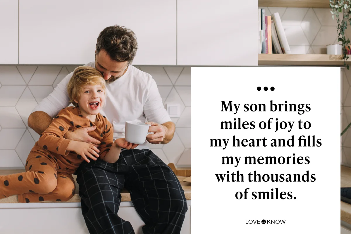 Father sitting on kitchen counter with his little son and having morning coffee