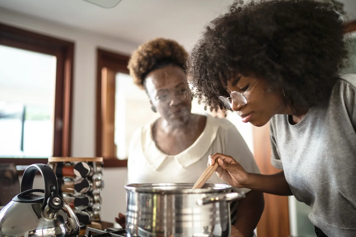 Daughter and mother cooking together