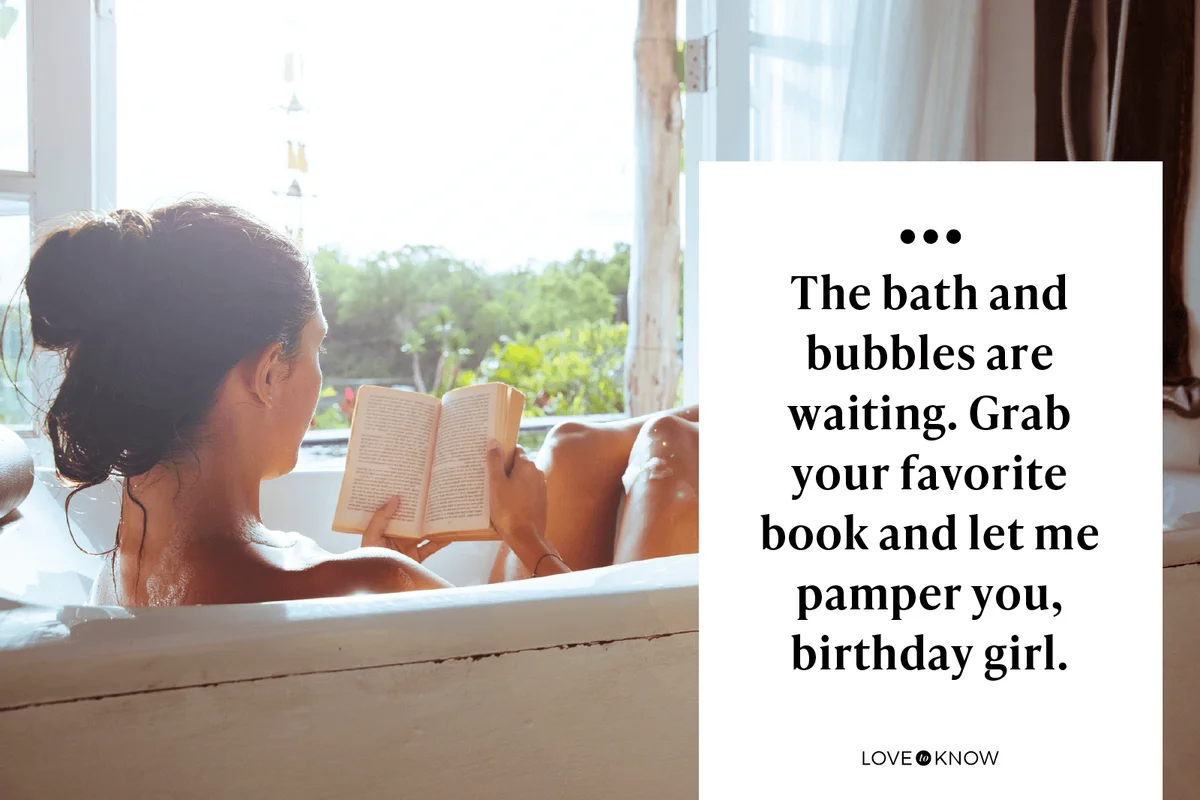 Woman relaxing in bathtub reading book