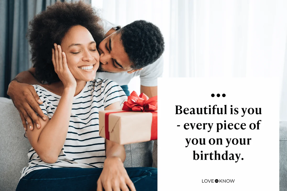 Cheerful young woman receiving a gift from her boyfriend
