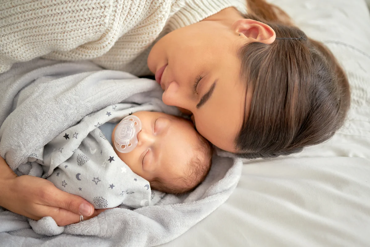 Mother and baby sleeping