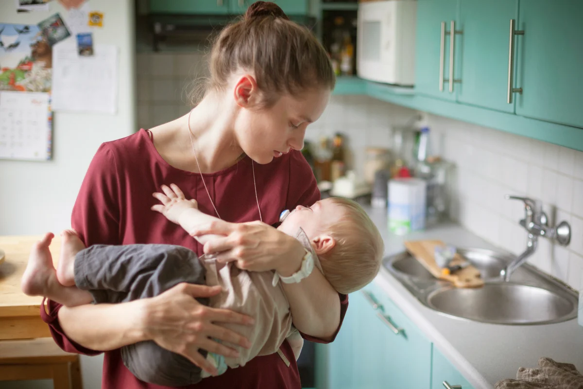Mother embracing son that is having trouble sleeping