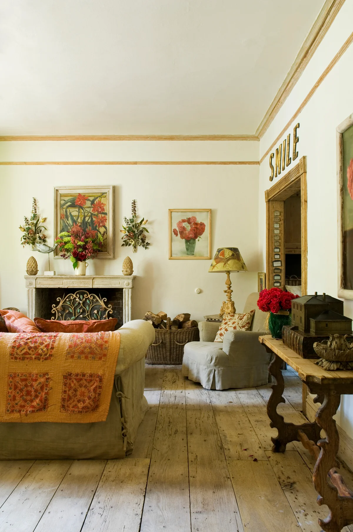 Paintings of flowers in a decorated living room
