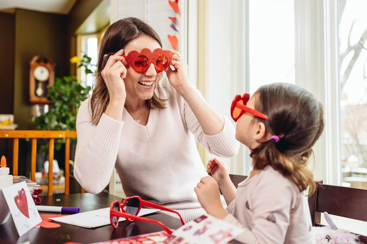 Mother and young daughter crafting for Valentine's Day