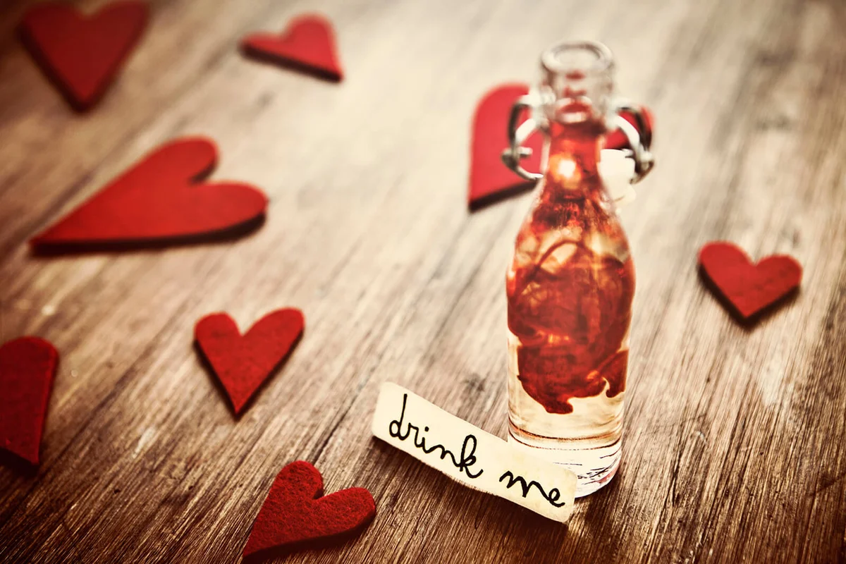Love potion on a small bottle with the words "Drink me"