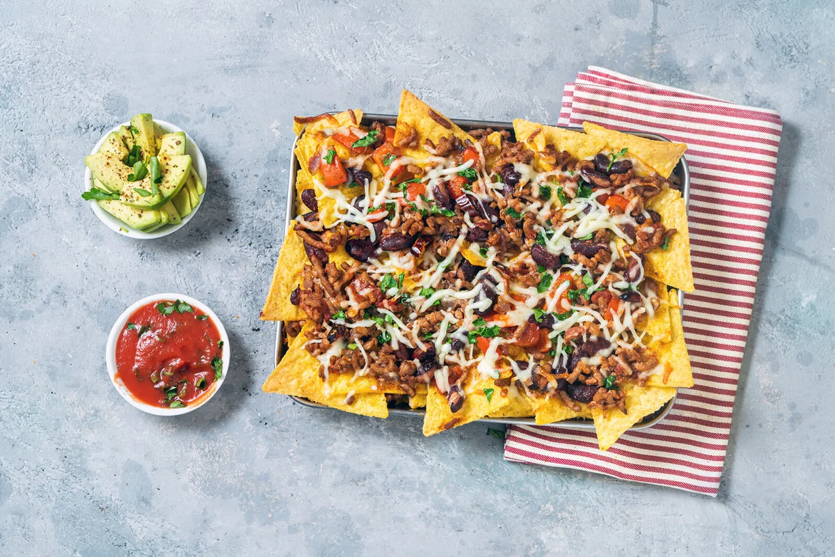 Baked nachos with chili con carne Mexican food