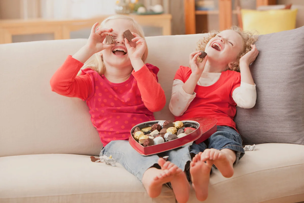 girls eating Valentine's candy