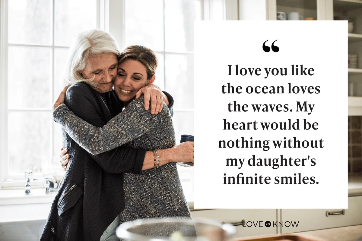 Mother and daughter hugging in kitchen